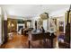 Open concept living room features hardwood floors, fireplace, piano, and stairway at 3168 Stanyarne Dr, Charleston, SC 29414