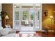 Elegant living room with hardwood floors and view of the enclosed sun room at 3168 Stanyarne Dr, Charleston, SC 29414