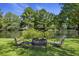 Seating area overlooking the lake with beautiful trees and landscaping at 3168 Stanyarne Dr, Charleston, SC 29414