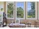 Sunroom with tranquil views of the lake, large windows, and natural light at 3168 Stanyarne Dr, Charleston, SC 29414