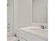 A bright bathroom features a tub and shower combination, a large mirror, and a white vanity sink at 323 Blue Haw Dr, Moncks Corner, SC 29461