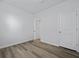 Neutral bedroom with wood-look flooring and a closet maximizing space and offering ample storage solutions at 323 Blue Haw Dr, Moncks Corner, SC 29461
