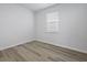 Bright bedroom with a window and wood-look flooring creating a serene and inviting space at 323 Blue Haw Dr, Moncks Corner, SC 29461