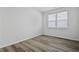 Well-lit bedroom with a window and wood-look flooring provides a comfortable and flexible space at 323 Blue Haw Dr, Moncks Corner, SC 29461