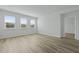Bright living room with large windows offering ample natural light and laminate flooring at 323 Blue Haw Dr, Moncks Corner, SC 29461