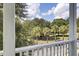 Balcony view of a street lined with palm trees and lush landscaping at 3302 Porchview Pl, Johns Island, SC 29455