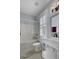 Bright bathroom featuring a bathtub, shower, and a vanity with a decorative mirror and plantation shutters at 3302 Porchview Pl, Johns Island, SC 29455