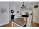 Well lit dining room with hardwood floors, chandelier, and black buffet at 3302 Porchview Pl, Johns Island, SC 29455