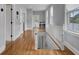 Second floor hallway with hardwood floors and white railing at 3302 Porchview Pl, Johns Island, SC 29455