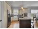 Modern kitchen with granite countertops, stainless steel appliances, and custom cabinets at 3302 Porchview Pl, Johns Island, SC 29455