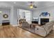 Comfortable living room with fireplace, open to dining area at 3302 Porchview Pl, Johns Island, SC 29455