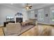 Cozy living room featuring a fireplace, hardwood floors, and natural light at 3302 Porchview Pl, Johns Island, SC 29455