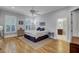 Bright main bedroom with hardwood floors and ensuite bathroom at 3302 Porchview Pl, Johns Island, SC 29455