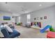 Large playroom with ample natural light and neutral carpet at 3302 Porchview Pl, Johns Island, SC 29455