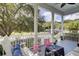 Comfortable porch with rocking chairs and seating with a view of the community and landscaping at 3302 Porchview Pl, Johns Island, SC 29455