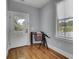 Bright room with hardwood floors, a door to a balcony, a large window with curtains and a telescope at 3302 Porchview Pl, Johns Island, SC 29455