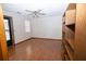 Bright bedroom with hardwood floors, ceiling fan, and a built-in bookshelf for storage at 389 Maggie Rd, Mount Pleasant, SC 29464