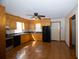 Spacious kitchen with light wood cabinets, black appliances, and a ceiling fan at 389 Maggie Rd, Mount Pleasant, SC 29464