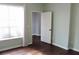 Bedroom with hardwood floors, natural light, and neutral colored walls at 45 Sycamore Ave # 1327, Charleston, SC 29407