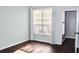 Bright bedroom featuring hardwood floors, a large window, and neutral paint at 45 Sycamore Ave # 1327, Charleston, SC 29407