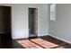 Bedroom with hardwood floors and open doors to closet and bathroom at 45 Sycamore Ave # 1327, Charleston, SC 29407