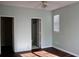 Bedroom featuring hardwood floors and open doors to closet and bathroom at 45 Sycamore Ave # 1327, Charleston, SC 29407