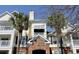 Multi-story condo building with well-maintained brick and siding exterior at 45 Sycamore Ave # 1327, Charleston, SC 29407