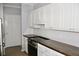 Kitchen area with white cabinets, wood counters, and stainless steel appliances at 45 Sycamore Ave # 1327, Charleston, SC 29407
