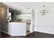 Eat-in kitchen area features a countertop bar and open layout with view of dining area at 45 Sycamore Ave # 1327, Charleston, SC 29407