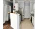 Open kitchen with white cabinets, dark wood counters, and stainless steel appliances at 45 Sycamore Ave # 1327, Charleston, SC 29407