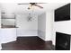 Open-concept living and dining area featuring a fireplace, modern light fixture, and kitchen view at 45 Sycamore Ave # 1327, Charleston, SC 29407