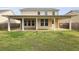 This backyard features a covered patio, perfect for outdoor entertaining and enjoying the view of the green lawn at 470 Gianna Ln, Goose Creek, SC 29445