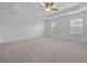 Large bedroom with carpet, ceiling fan, and two windows that allow for lots of natural light at 470 Gianna Ln, Goose Creek, SC 29445