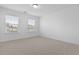 A bright bedroom with two windows and neutral carpet at 470 Gianna Ln, Goose Creek, SC 29445