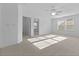Bright bedroom with carpet, ceiling fan, and two large windows that allow for lots of natural light at 470 Gianna Ln, Goose Creek, SC 29445