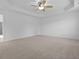 Large carpeted bedroom with ceiling fan and tray ceiling at 470 Gianna Ln, Goose Creek, SC 29445