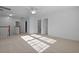 A bedroom with neutral carpet, ceiling fan, and natural light streaming through the large windows at 470 Gianna Ln, Goose Creek, SC 29445