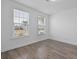 A bright bedroom with hardwood flooring and windows, offering a clean and inviting space at 470 Gianna Ln, Goose Creek, SC 29445