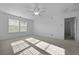 Bedroom with carpet, ceiling fan, and two large windows that allow for lots of natural light at 470 Gianna Ln, Goose Creek, SC 29445