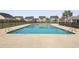 Large community pool with ample deck space and lush landscaping at 470 Gianna Ln, Goose Creek, SC 29445