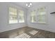 Bright dining room featuring wood floors and large windows with natural light at 470 Gianna Ln, Goose Creek, SC 29445