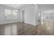 Open-concept dining area filled with natural light and modern chandelier at 470 Gianna Ln, Goose Creek, SC 29445
