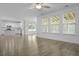 Open living space with windows galore and access to an island kitchen at 470 Gianna Ln, Goose Creek, SC 29445
