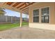 Covered patio with stamped concrete, ceiling fan, wood ceiling and an outdoor backyard view at 470 Gianna Ln, Goose Creek, SC 29445
