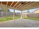 Covered patio with stamped concrete, ceiling fan, wood ceiling and an outdoor backyard view at 470 Gianna Ln, Goose Creek, SC 29445