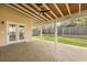 Covered patio with stamped concrete, ceiling fan, wood ceiling and an outdoor backyard view at 470 Gianna Ln, Goose Creek, SC 29445