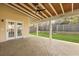 Covered patio with stamped concrete, ceiling fan, wood ceiling and an outdoor backyard view at 470 Gianna Ln, Goose Creek, SC 29445