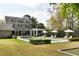 Beautiful backyard showcasing a pool, covered patio, and lush green lawn at 478 Huger St, Charleston, SC 29403