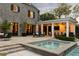 Outdoor living area featuring a patio with a seating area, hot tub, and access to the outdoor kitchen at 478 Huger St, Charleston, SC 29403