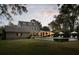 Expansive lawn and pool offer a serene retreat, with a stone house and patio, great for outdoor living at 478 Huger St, Charleston, SC 29403